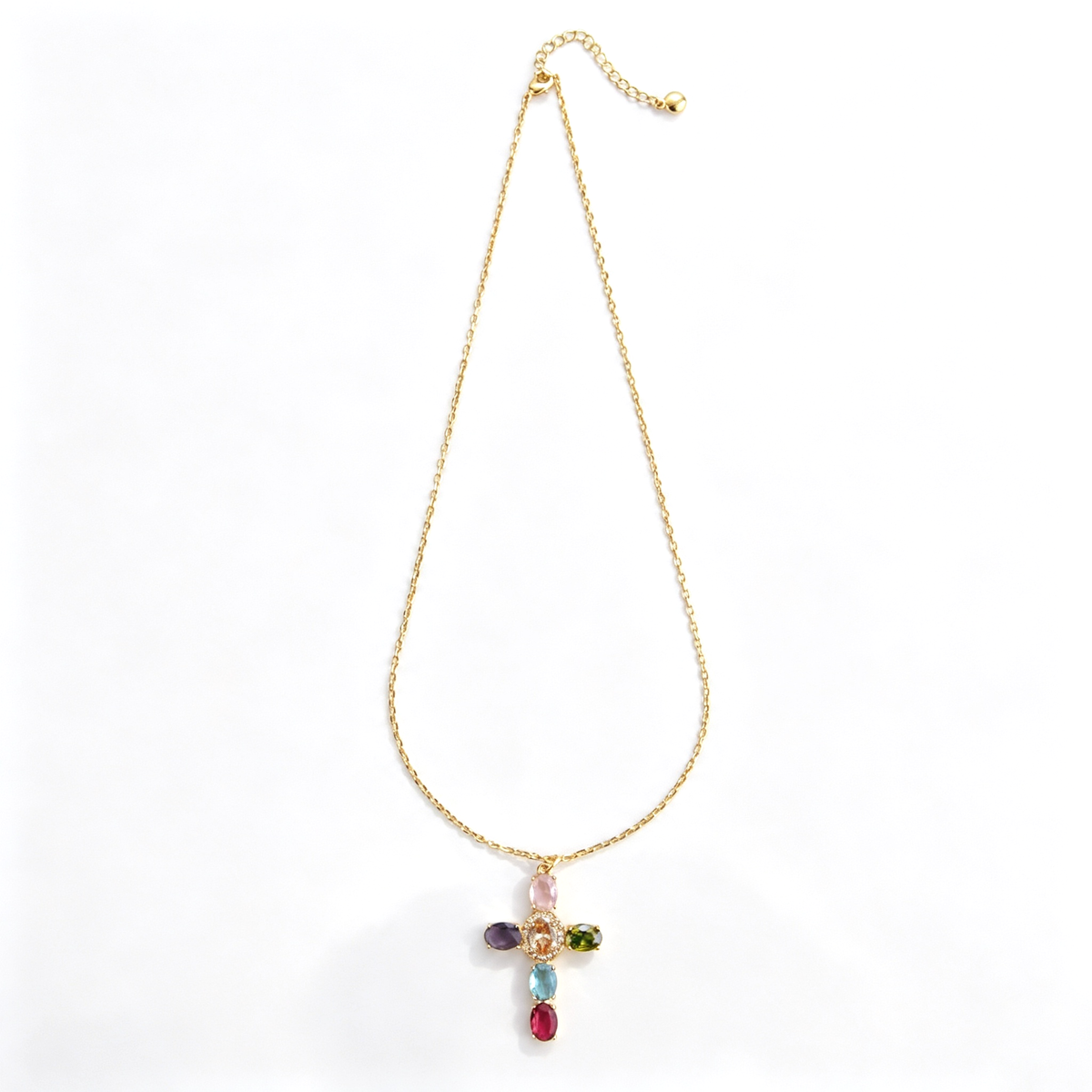 Multicolor cross pendant necklace shown in a close-up of the clasp and extension chain