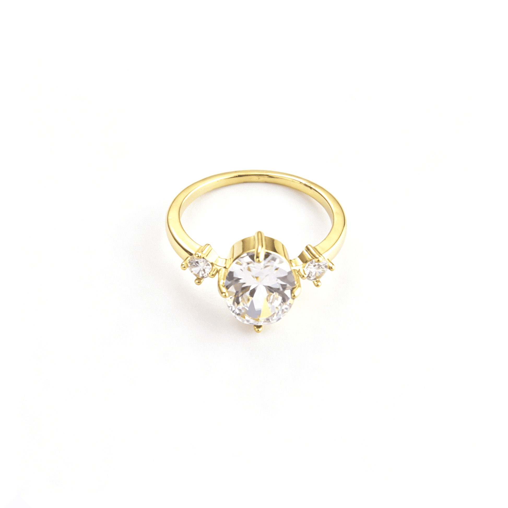 Top detailed view of Ever P. vintage engagement style gold-plated ring with shimmering oval and round cz stones.