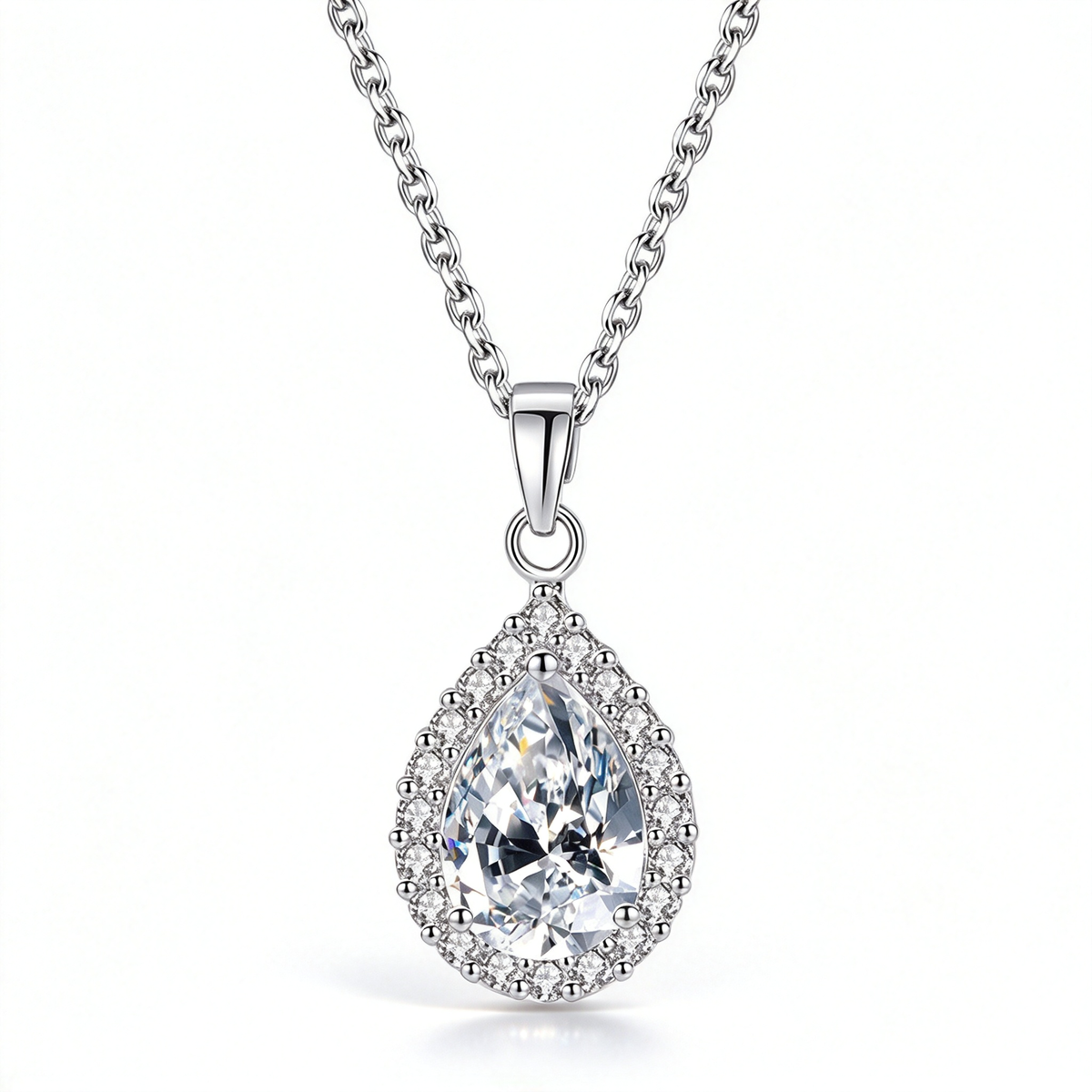 Clear pear-shaped pendant necklace with a faceted centerpiece and a halo of smaller decorative stones.