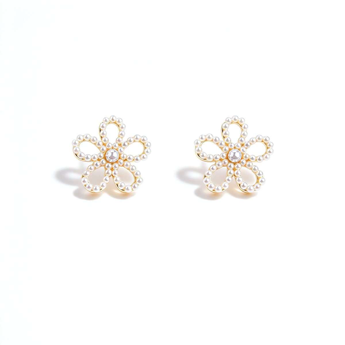 Pearl flower stud earrings shown as a matching pair against a white background.