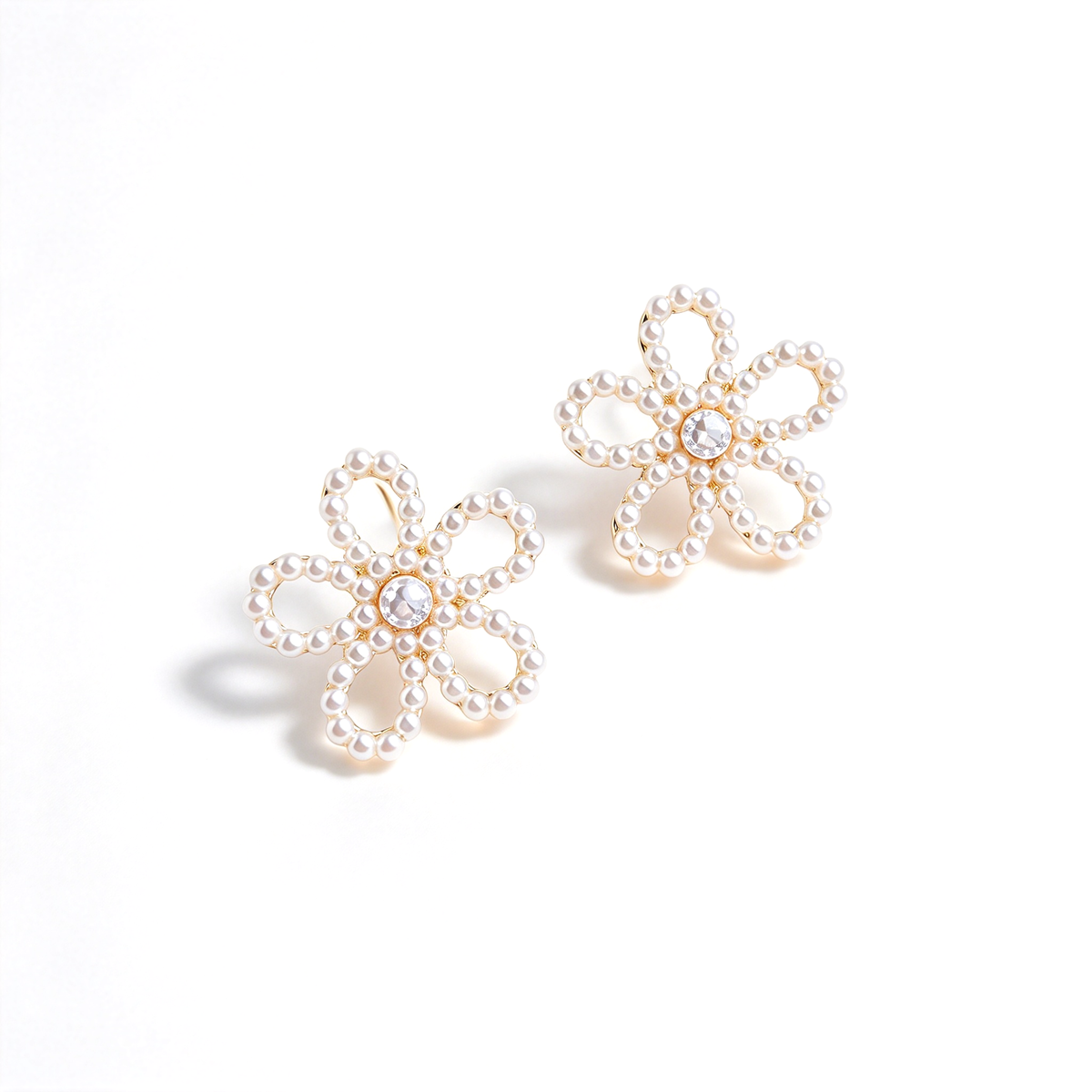Angled view of the flower stud earrings highlighting the layered petal design.