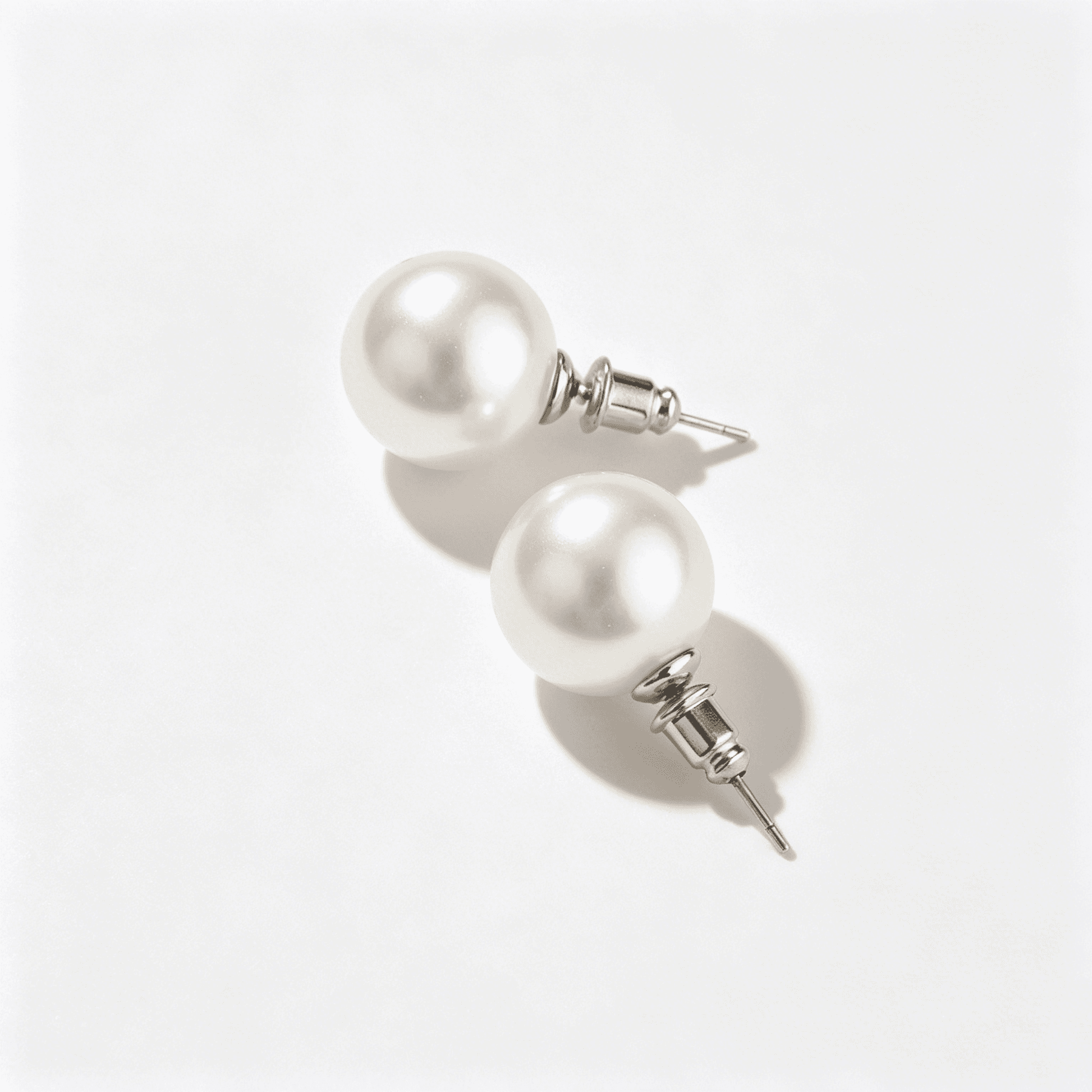 Ever P. large 13mm pearl stud earrings with a high-luster finish for a timeless jewelry look.