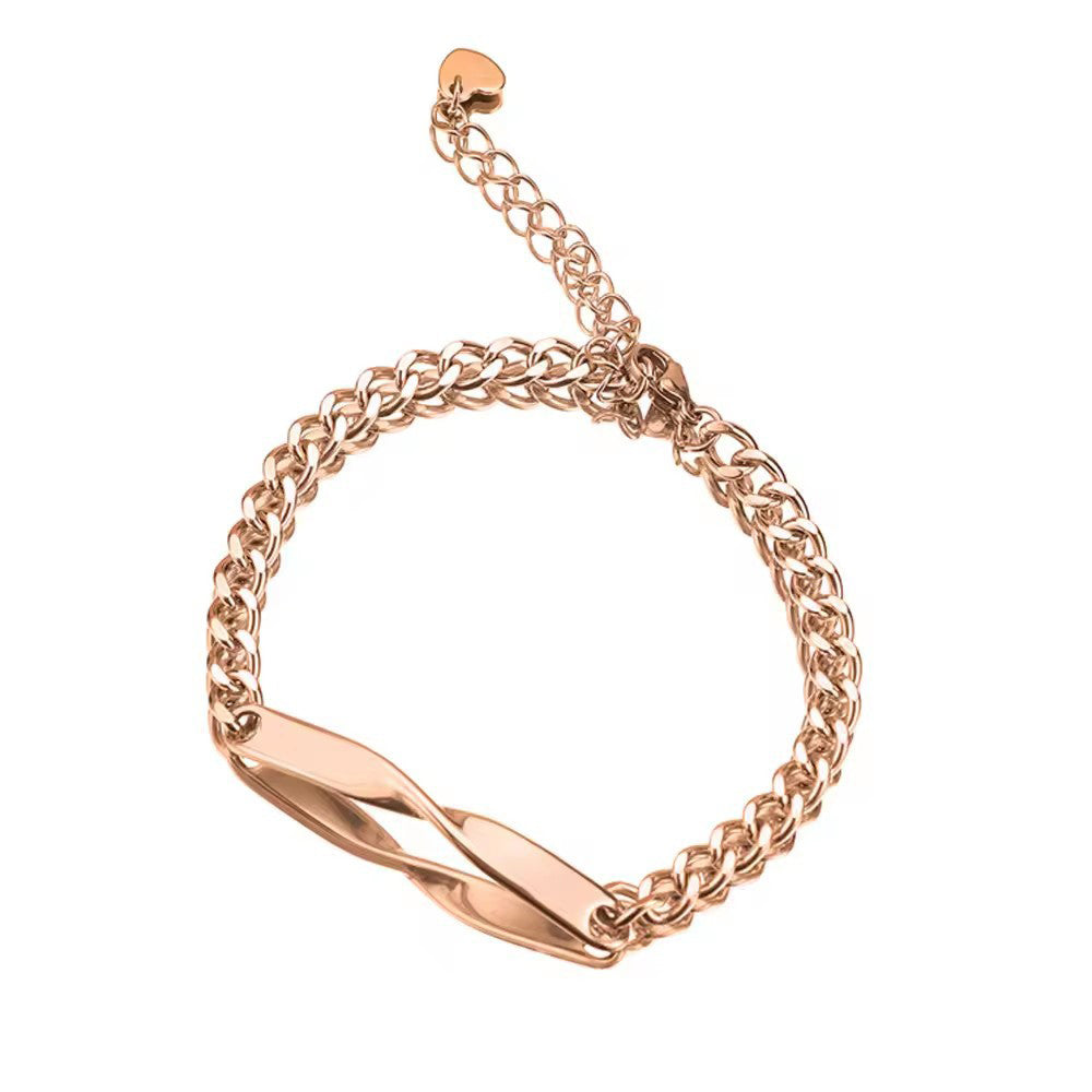 Rose-tone bracelet with an adjustable extension chain and a slim curved nameplate, photographed on a white background.