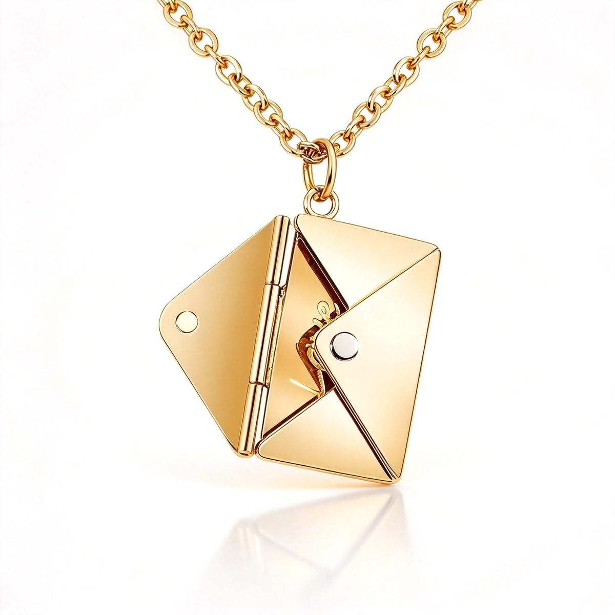Gold-tone envelope pendant shown open, highlighting its angular folded panels and central hinge.