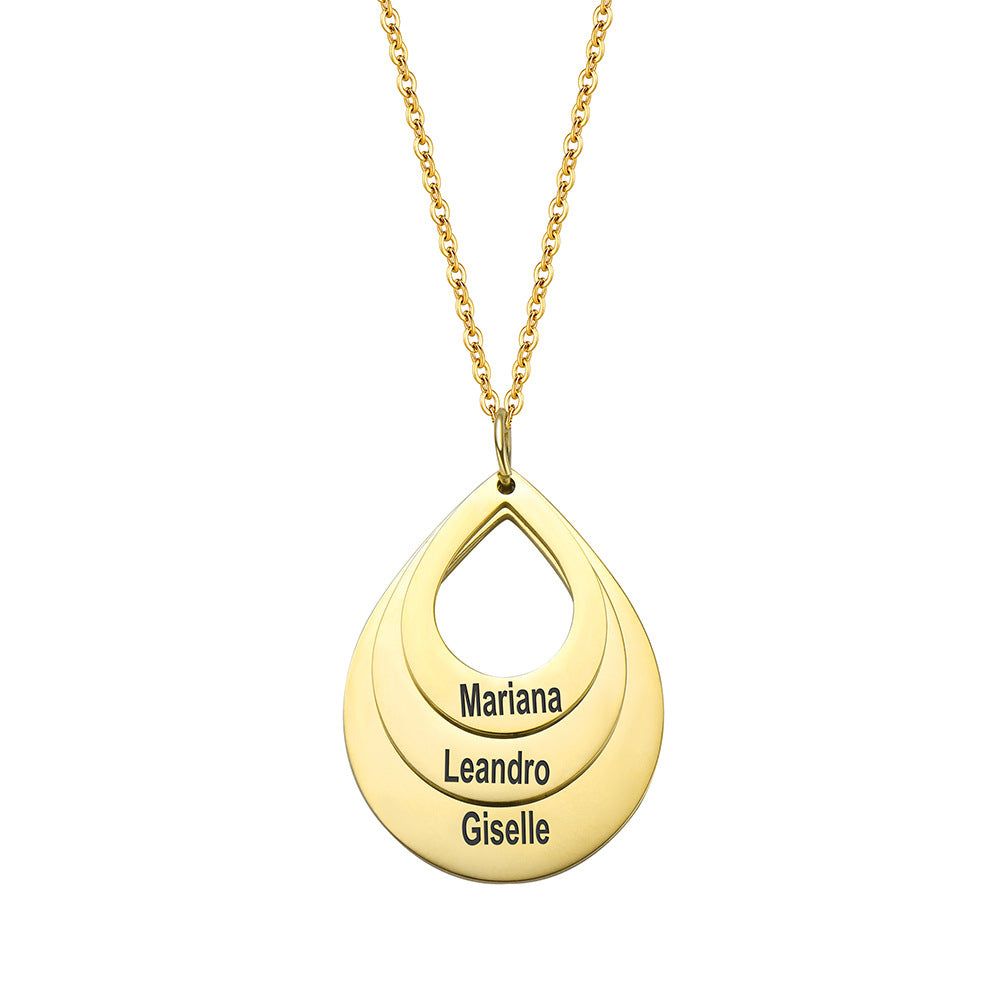 Gold-tone teardrop pendant necklace with layered outlines and personalized lettering, front view.