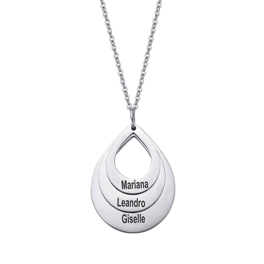Silver-tone necklace showing the open teardrop pendant and custom name lettering from the front.