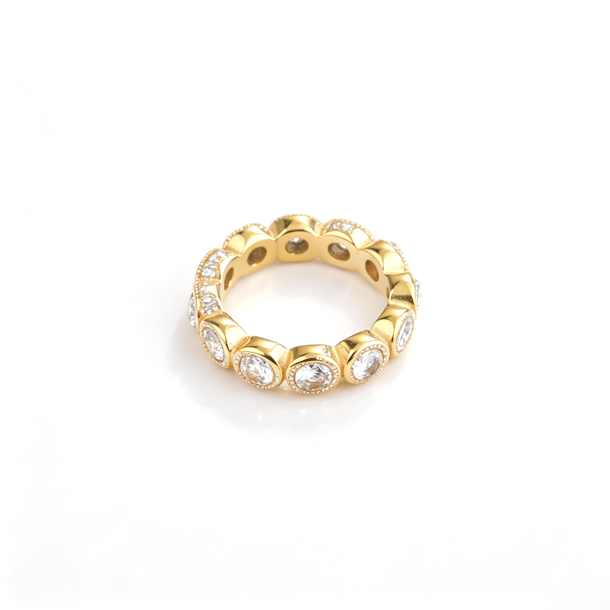 Round bezel band ring shown from an angled front view with repeating circular settings