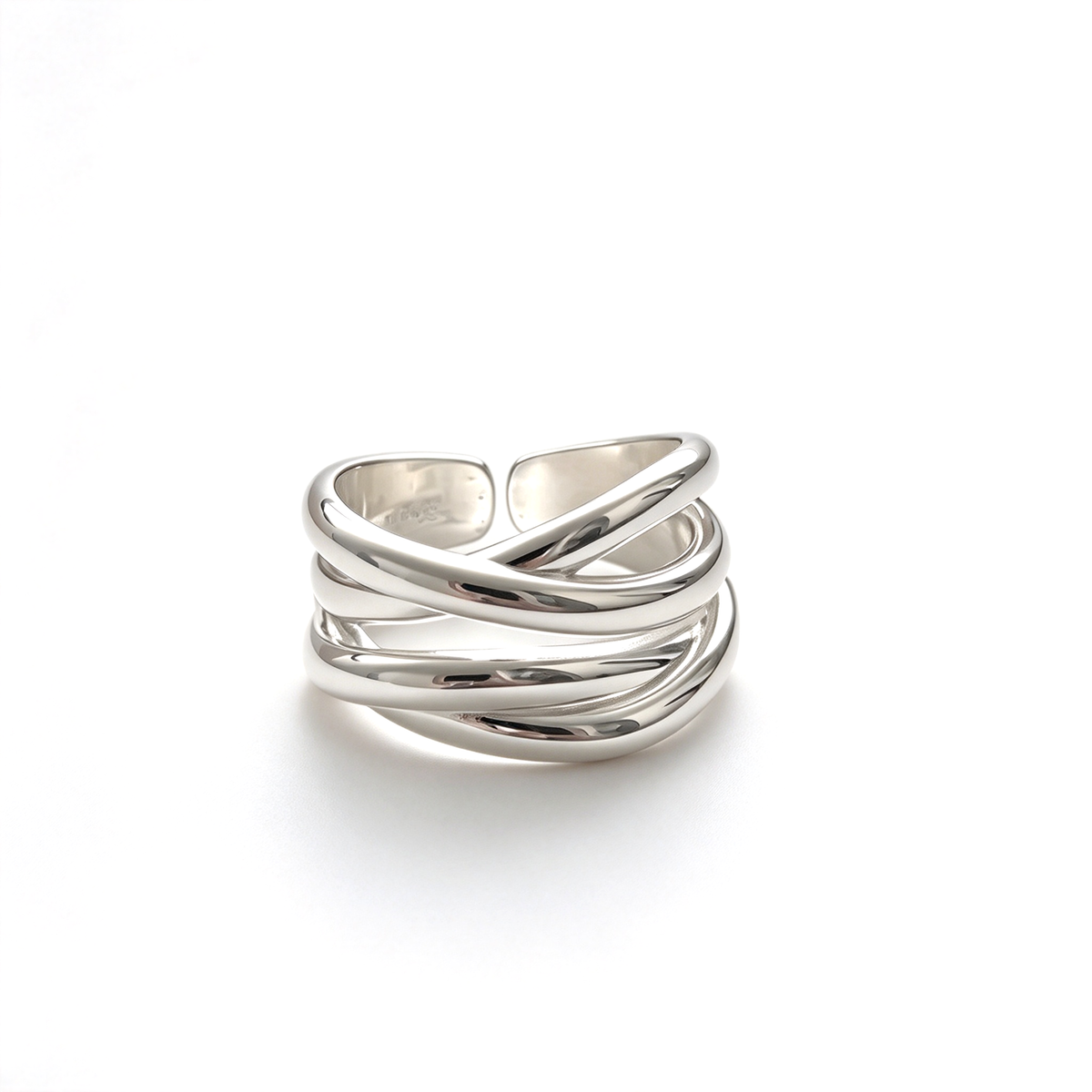 Gold-tone sculptural crossover ring with interwoven bands shown on a white background