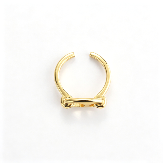 Sculptural cuff bracelet shown from an angled view with its open band