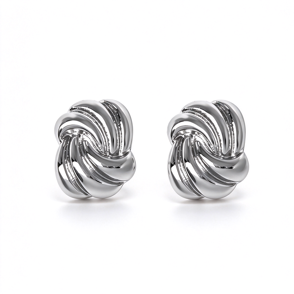 Silver-tone sculptural knot stud earrings featuring an interwoven design with dimensional curved details.