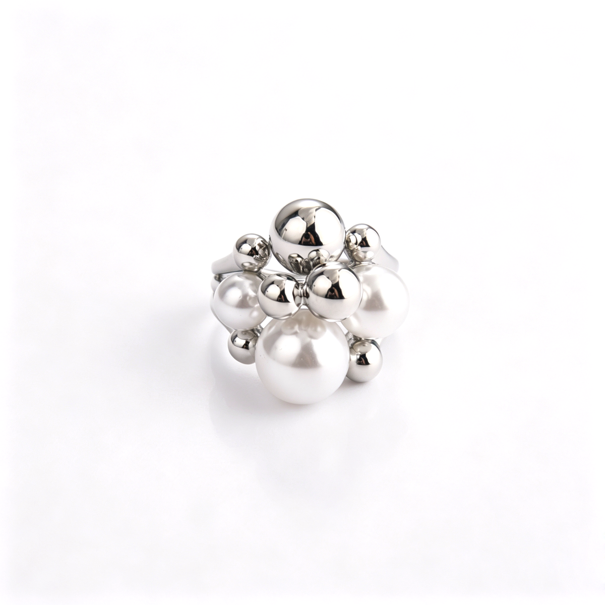 Frontal top-down view of silver-plated cluster ring displaying pearl and polished sphere arrangement.