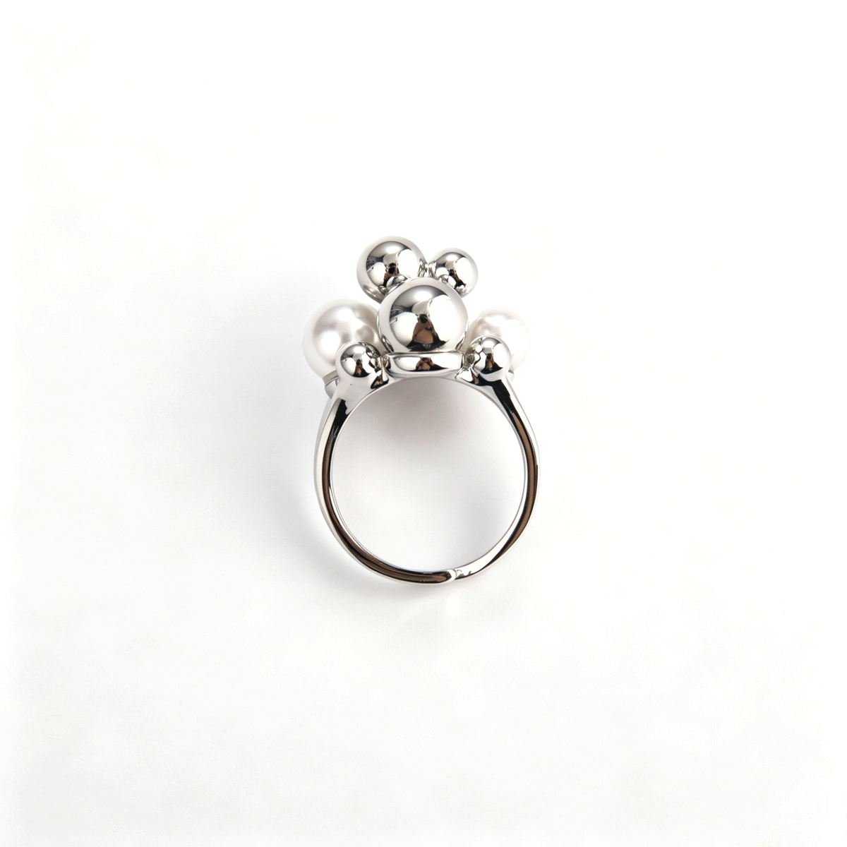 Bottom view of silver adjustable cluster ring showing interior band design and mounting construction.
