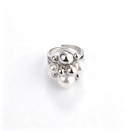 Overview of silver-tone bubble cluster ring with faux pearls set against a clean white background.