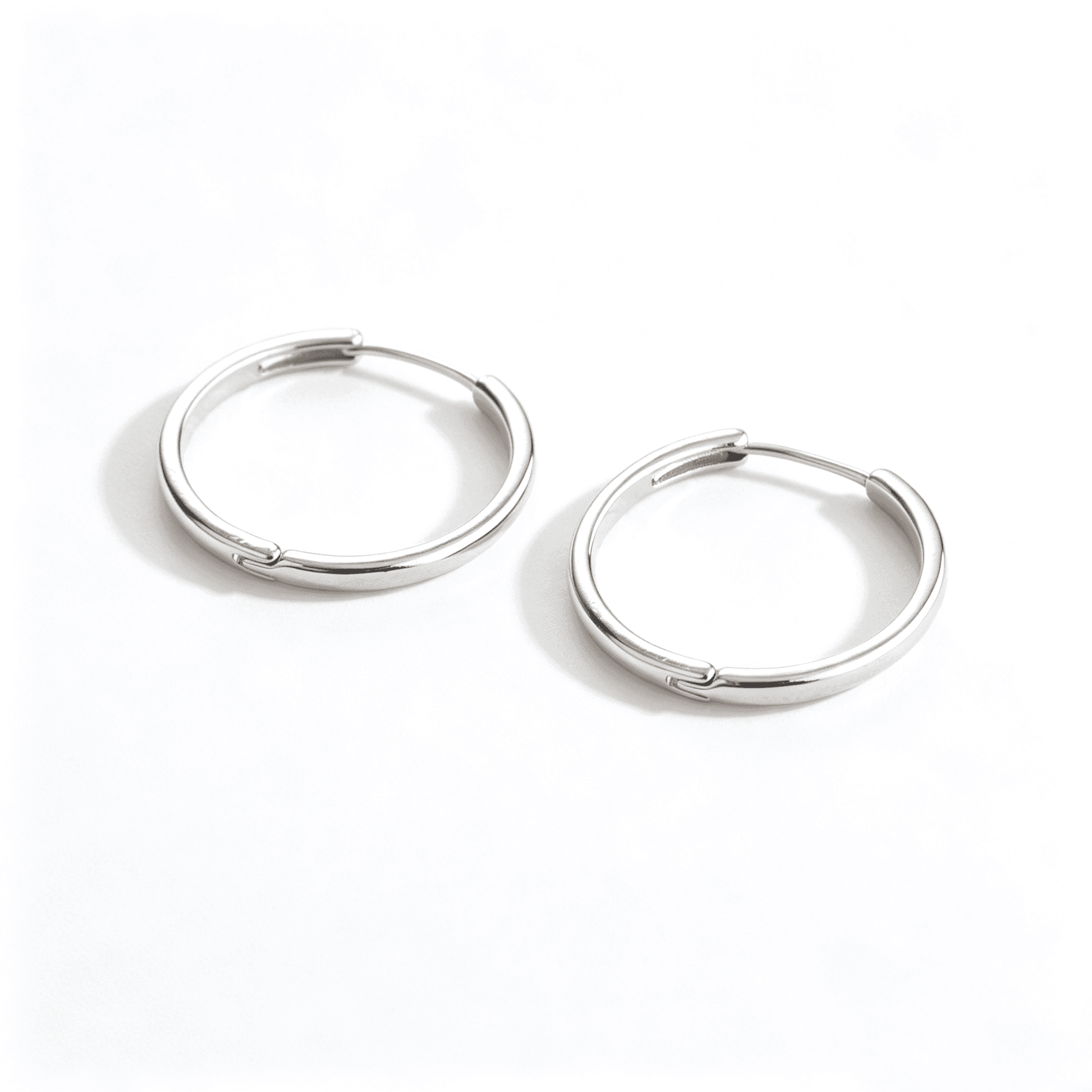 Ever P. silver hoop earrings with a 2.5cm diameter and a high-polish minimalist design.