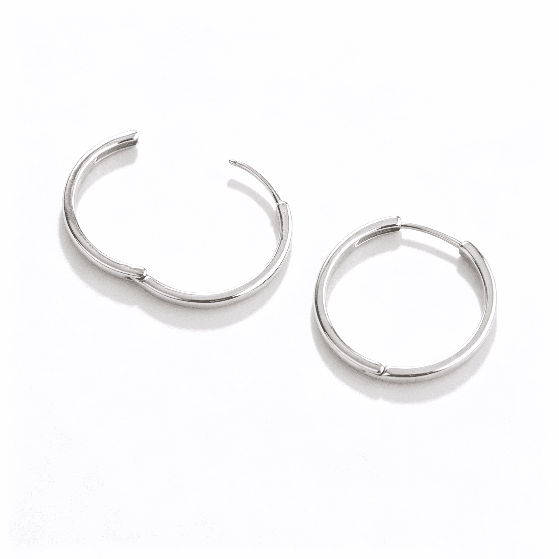 Everyday essential silver hoop earrings in a 25mm size, designed by Ever P. Jewelry.