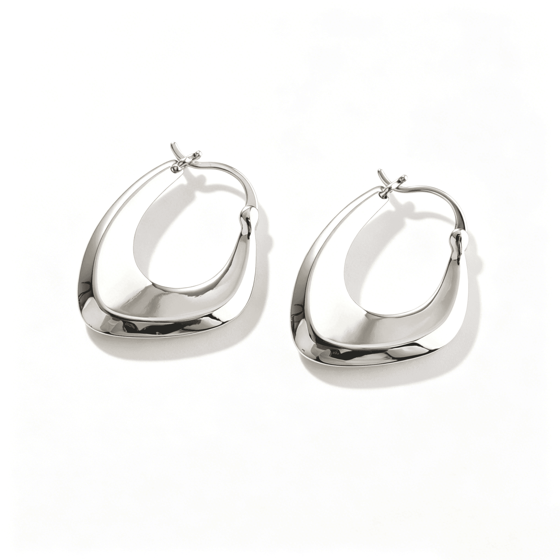 Ever P. minimalist cross hoop earrings, the perfect silver accessory for everyday elegance.