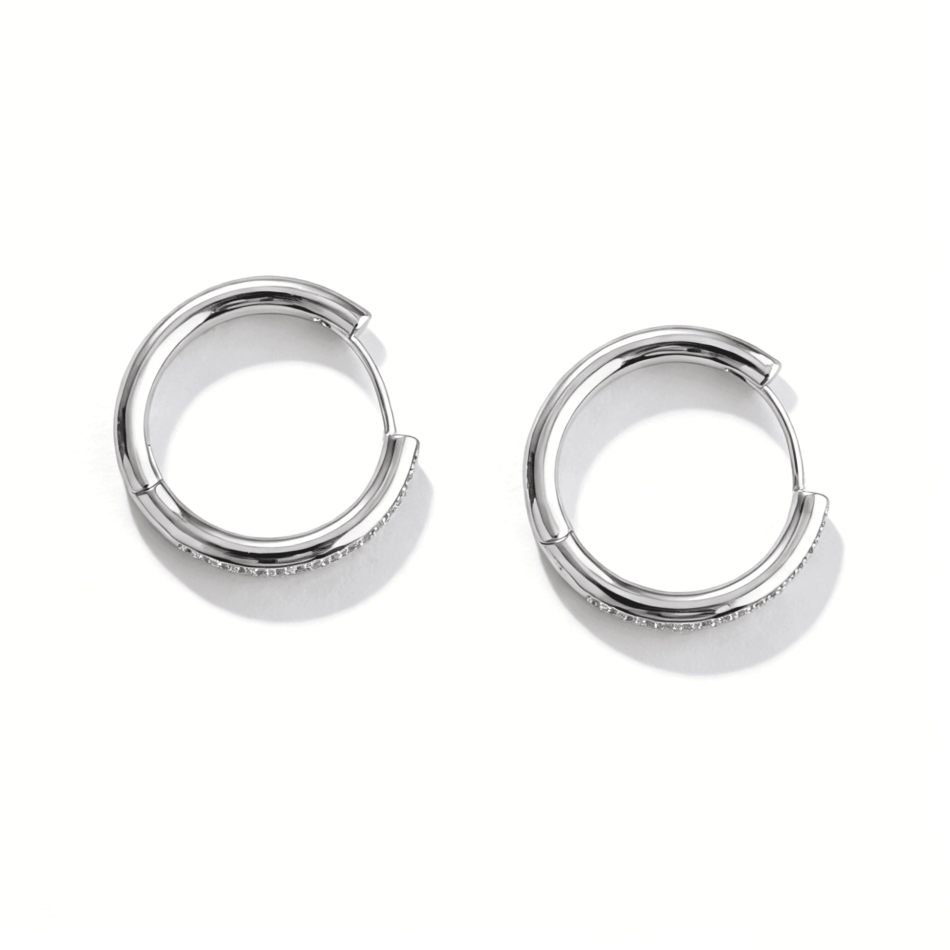 Side profile of silver pave hoop earrings showing the 14k gold post for sensitive ears.