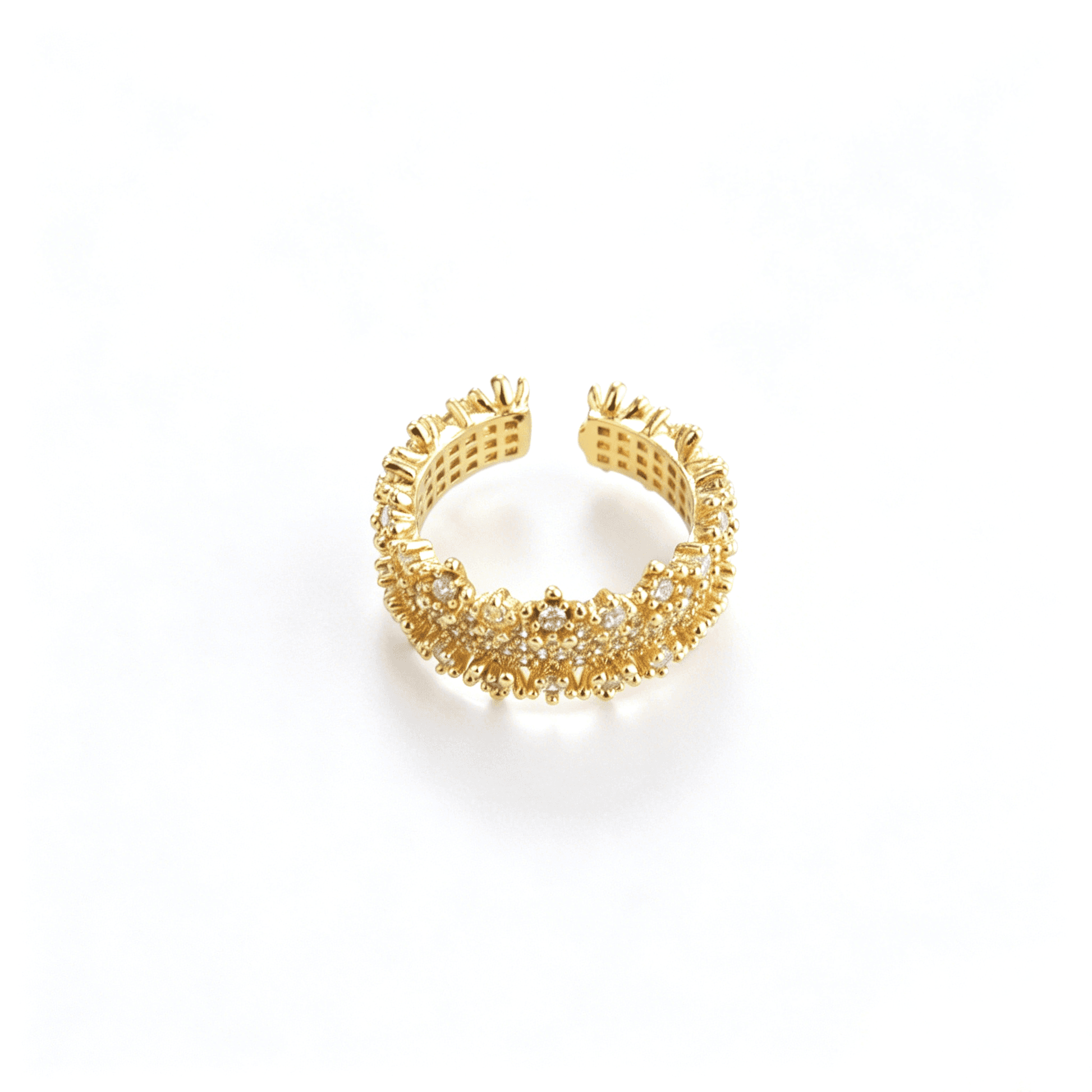 Front centered shot of the 18k gold-plated open band ring with multi-layer micro-pavé cubic zirconia and a crown-like starburst edge.