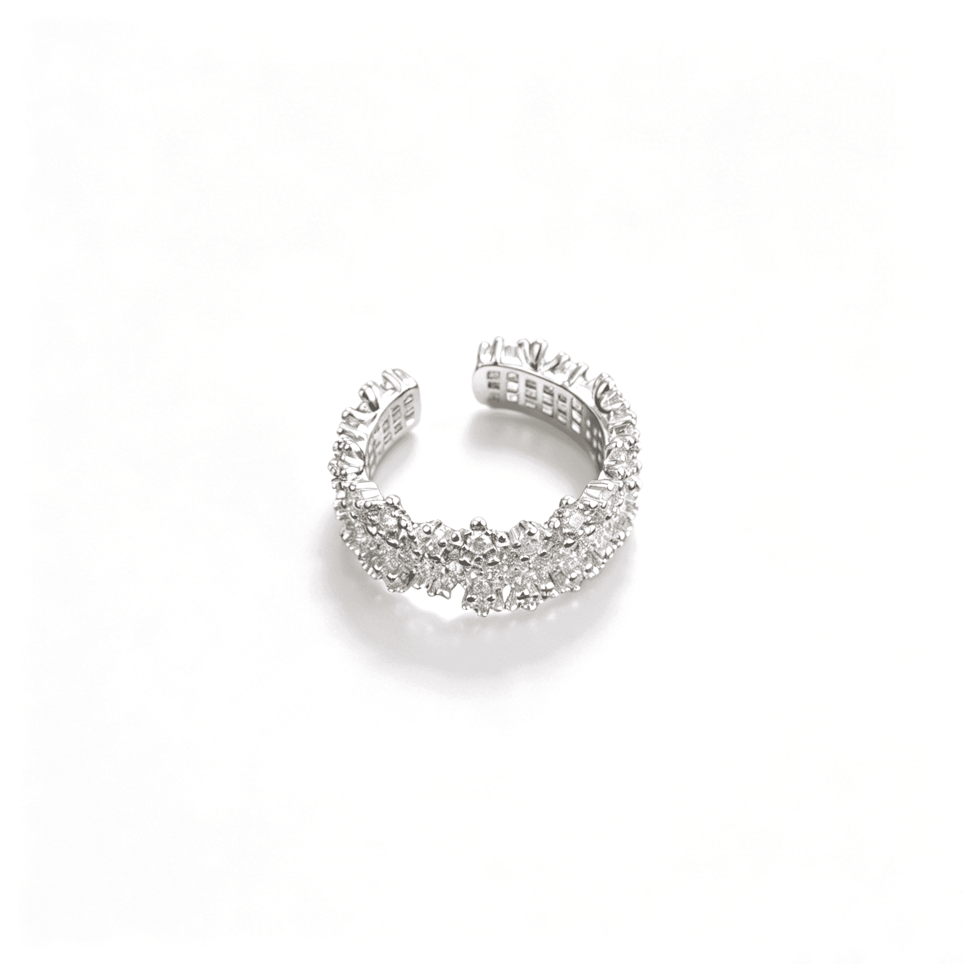 Angled profile shot of the silver sparkling pavé cz open band ring showcasing the icy shimmer of the micro-crystals.