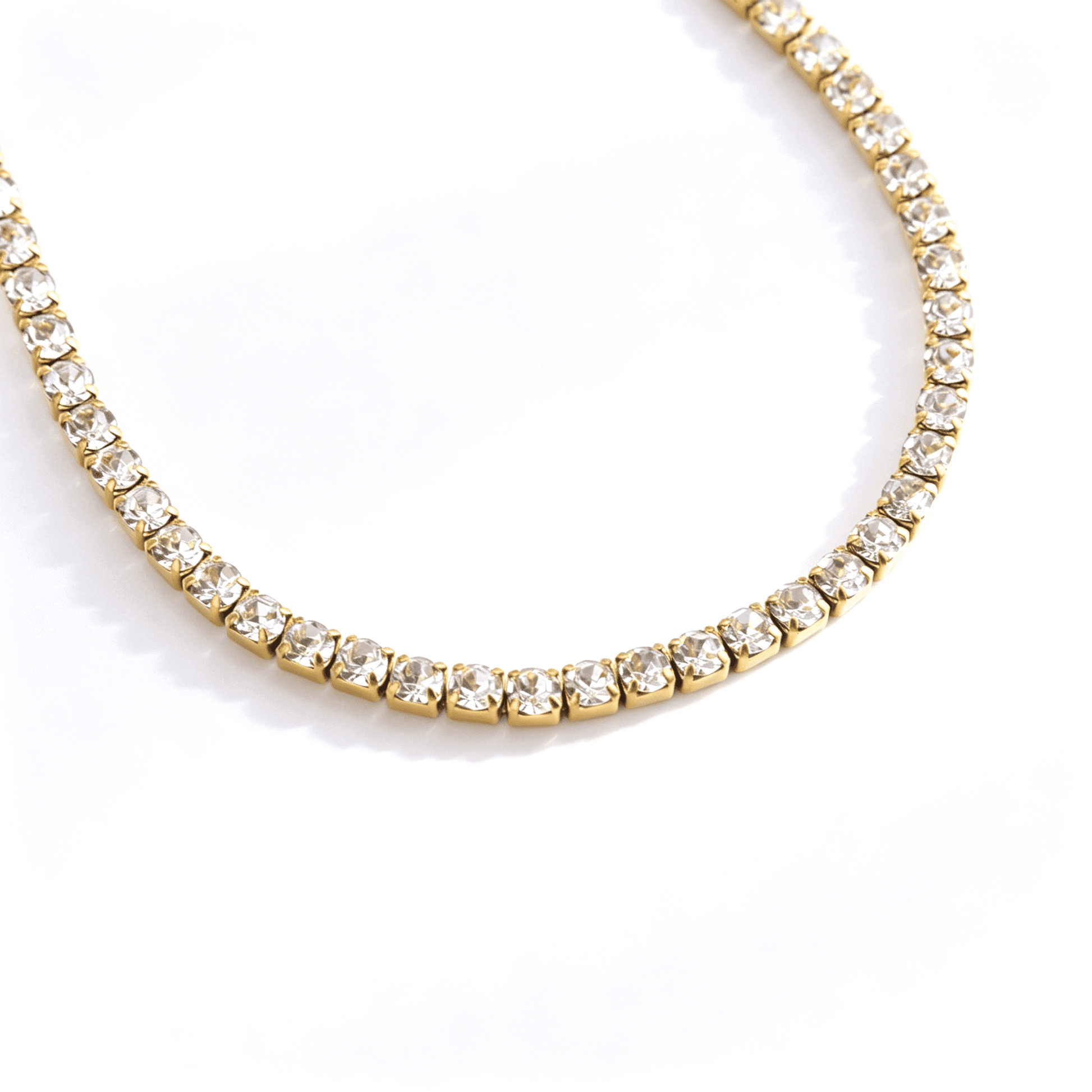 Curved front section of a gold-tone cubic zirconia tennis necklace