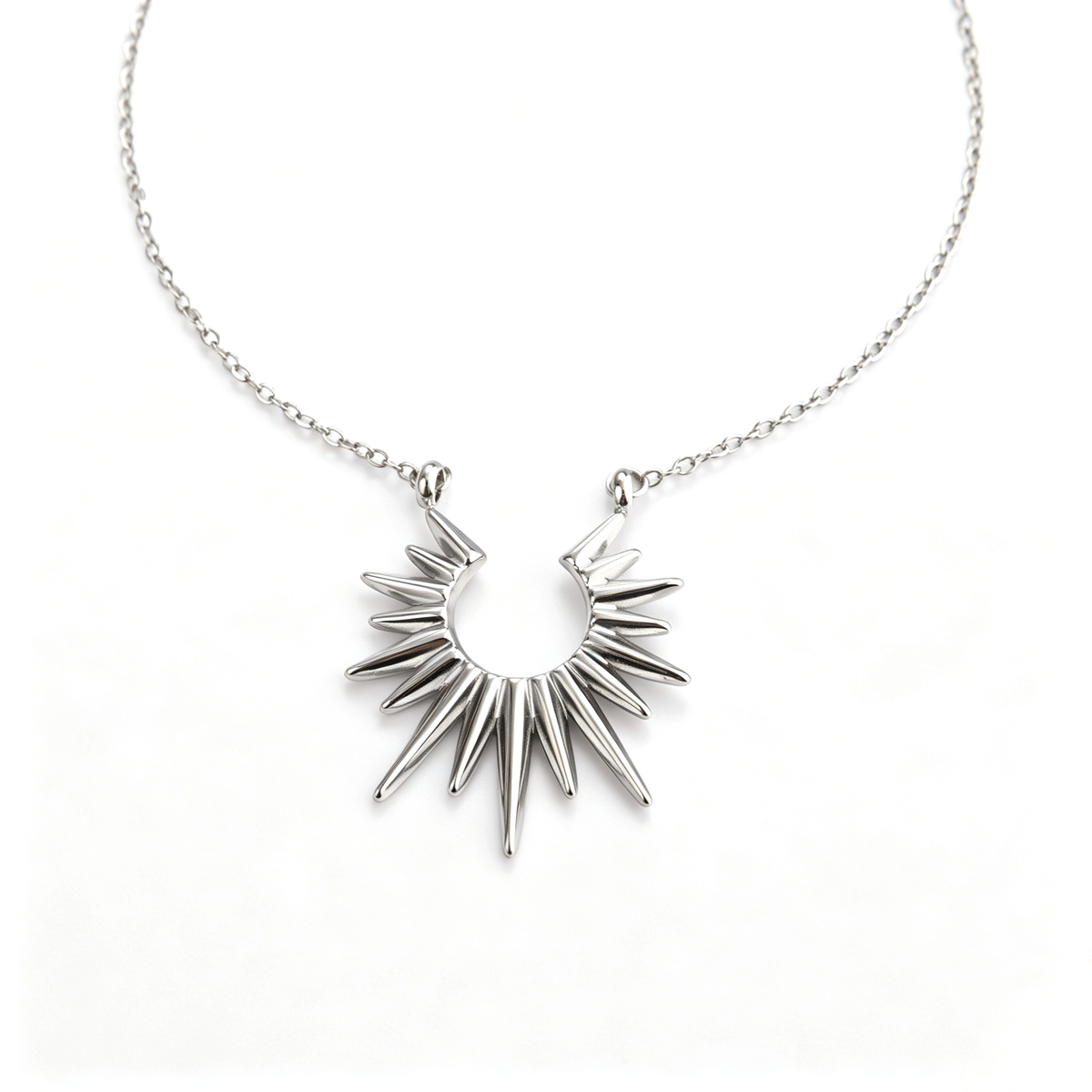 Direct front view of the polished stainless steel sunburst spike pendant necklace.