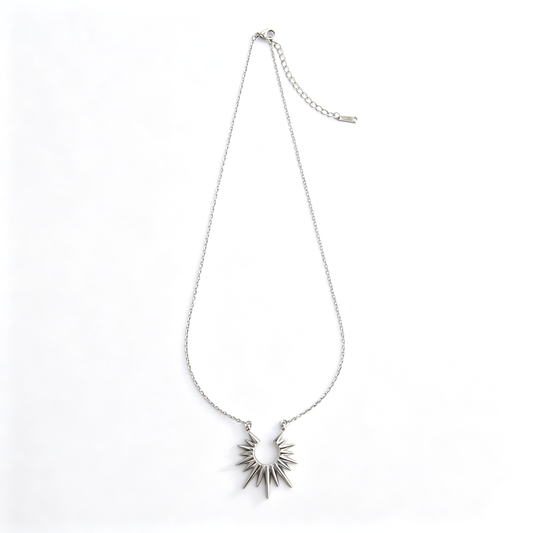 Full layout view of the stainless steel curb chain necklace with a radiating sunburst pendant.