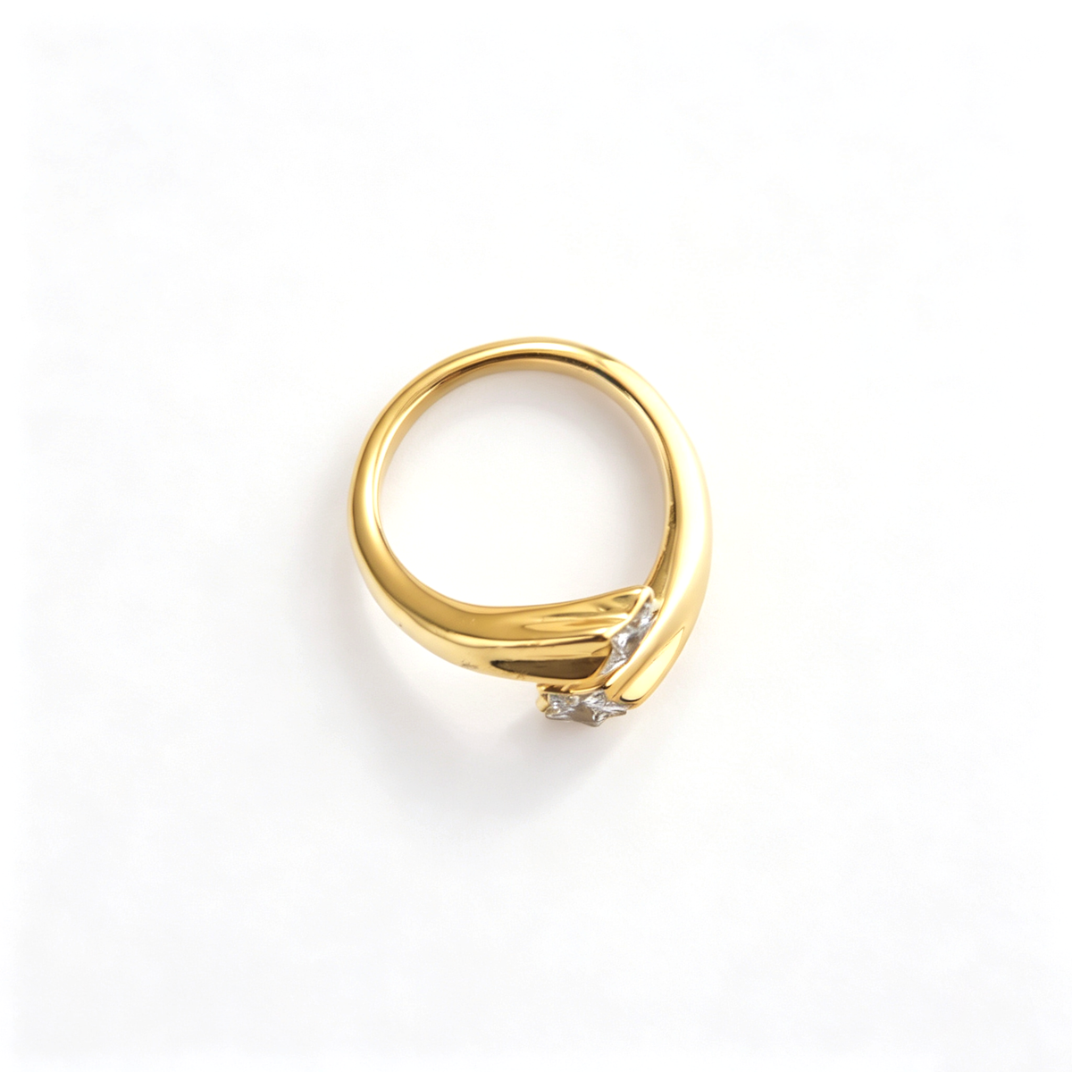 Open cuff ring shown from a three-quarter angle with matching star-shaped details
