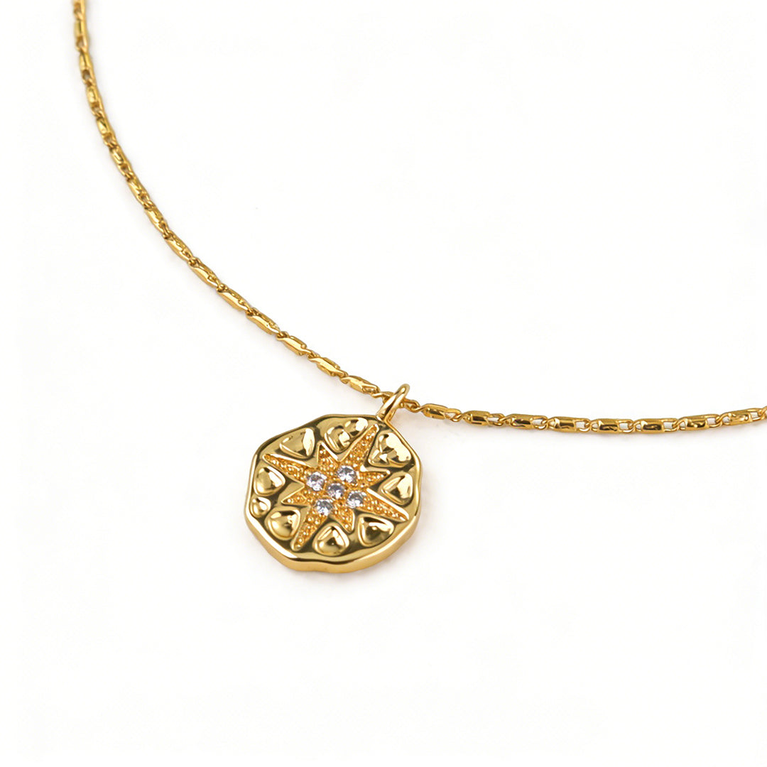 Celestial style star pendant necklace with a sparkling cubic zirconia center stone.