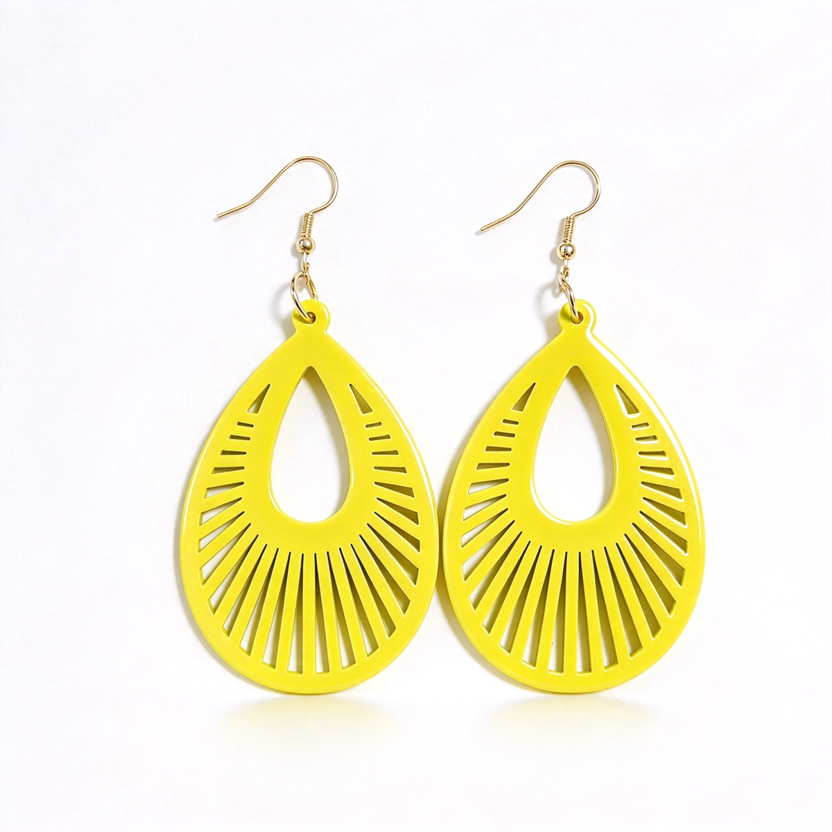 Bright yellow sunburst teardrop dangle earrings shown together against a white background.