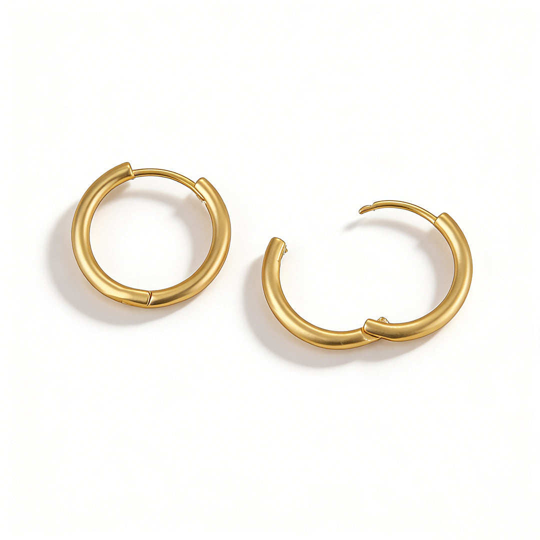 Tarnish-resistant gold earrings with a premium brass base and high-shine finish.