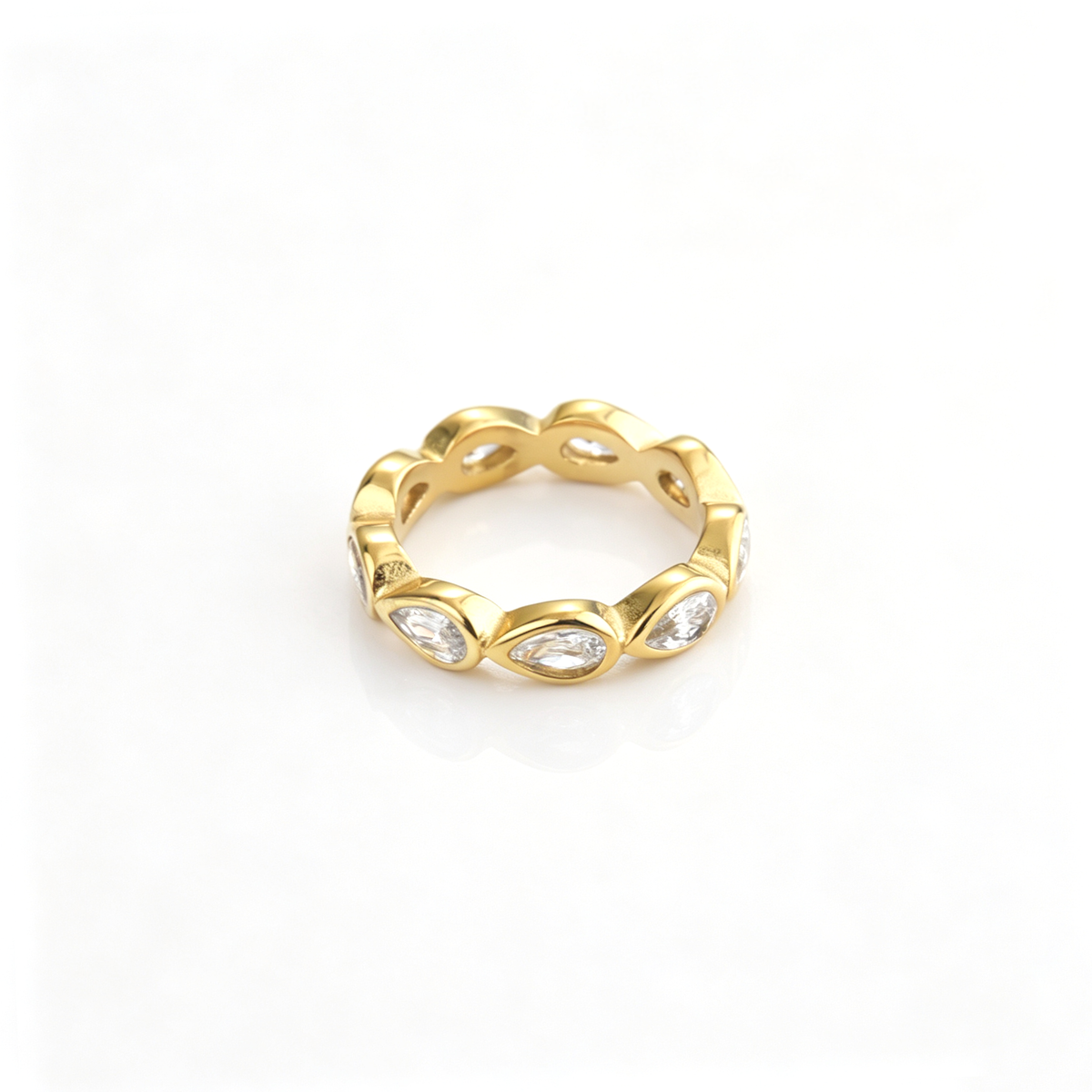 Teardrop accent band ring shown from a front angled view with repeating sculpted details