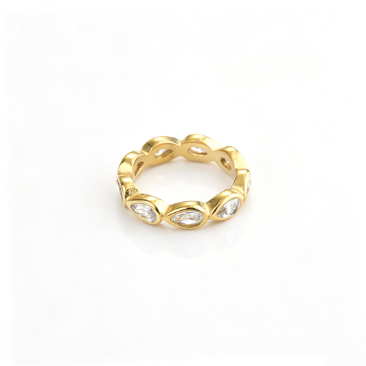 Teardrop accent band ring shown from a front angled view with repeating sculpted details
