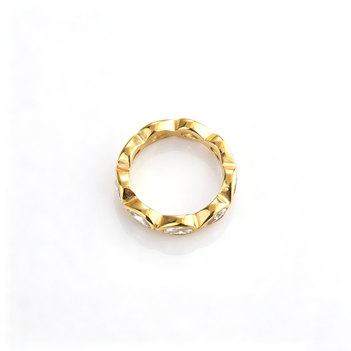 Teardrop accent ring shown from the rear, revealing the continuous band and sculpted settings