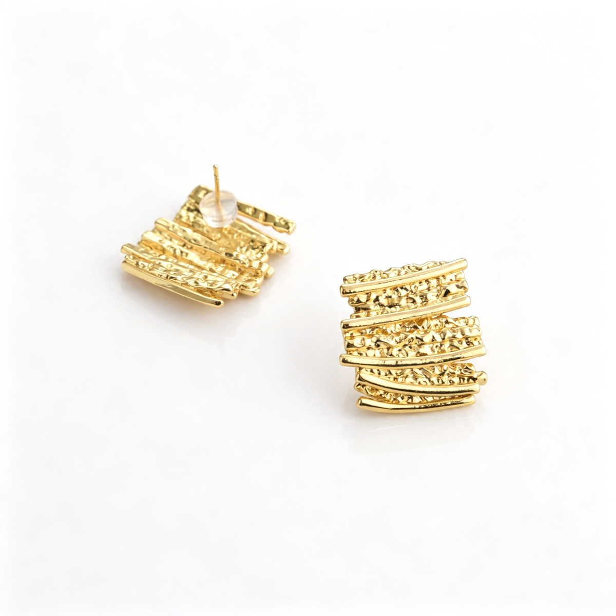 Back view of stud earrings showing the posts and disk backings