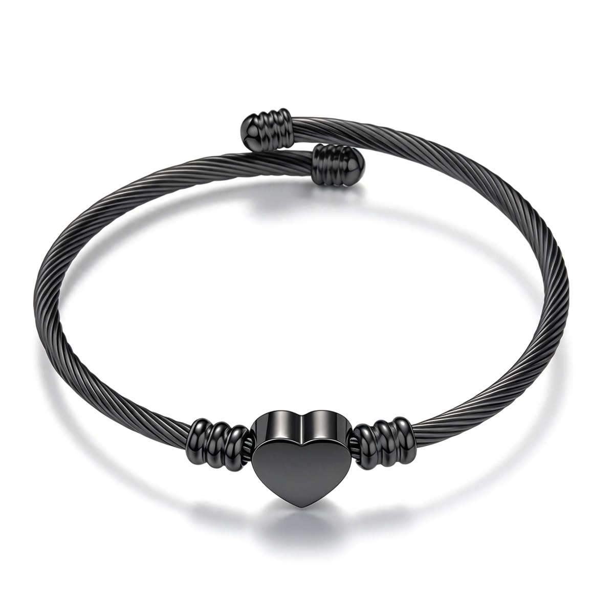 Black heart cuff bracelet shown from the front, with twisted cable detailing and rounded accents.