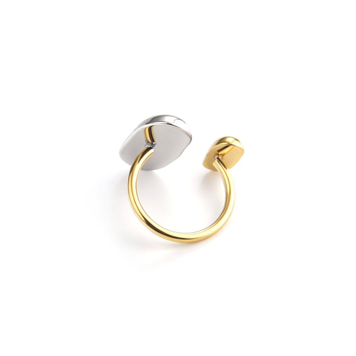 Sculptural cuff ring shown from a three-quarter view with its contrasting end pieces