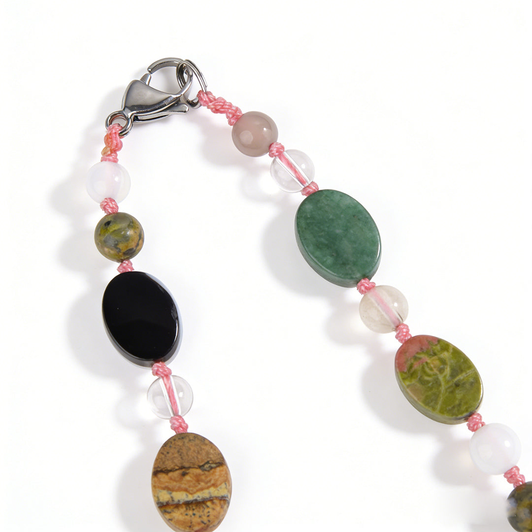Versatile beaded jewelry that can be worn as a wrap bracelet or a long beaded necklace.