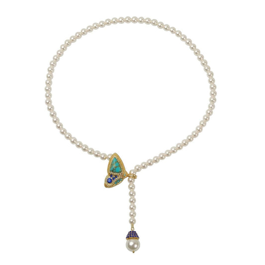 Studio shot of the 40cm vintage forest-style butterfly pearl Y-necklace, showcasing the turquoise wing clasp and dropping pearl end isolated on white background.