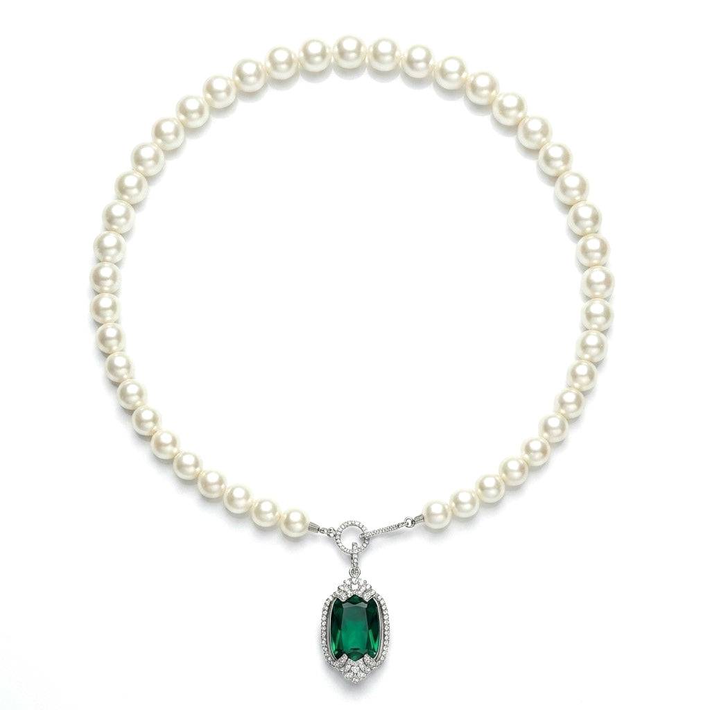 Professional studio product shot of the vintage emerald rhinestone pendant pearl necklace with white background.