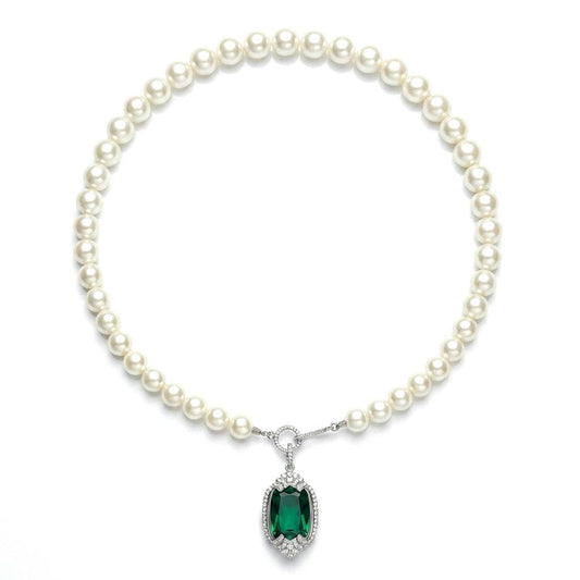 Professional studio product shot of the vintage emerald rhinestone pendant pearl necklace with white background.