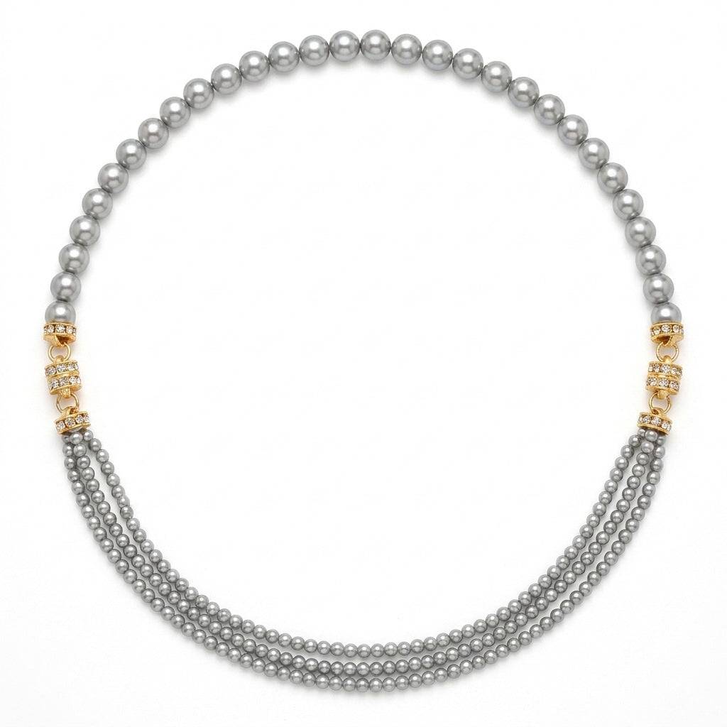 Studio flat lay of the 92.5cm grey multi-strand pearl choker necklace with gold crystal spacers on a clean white background.