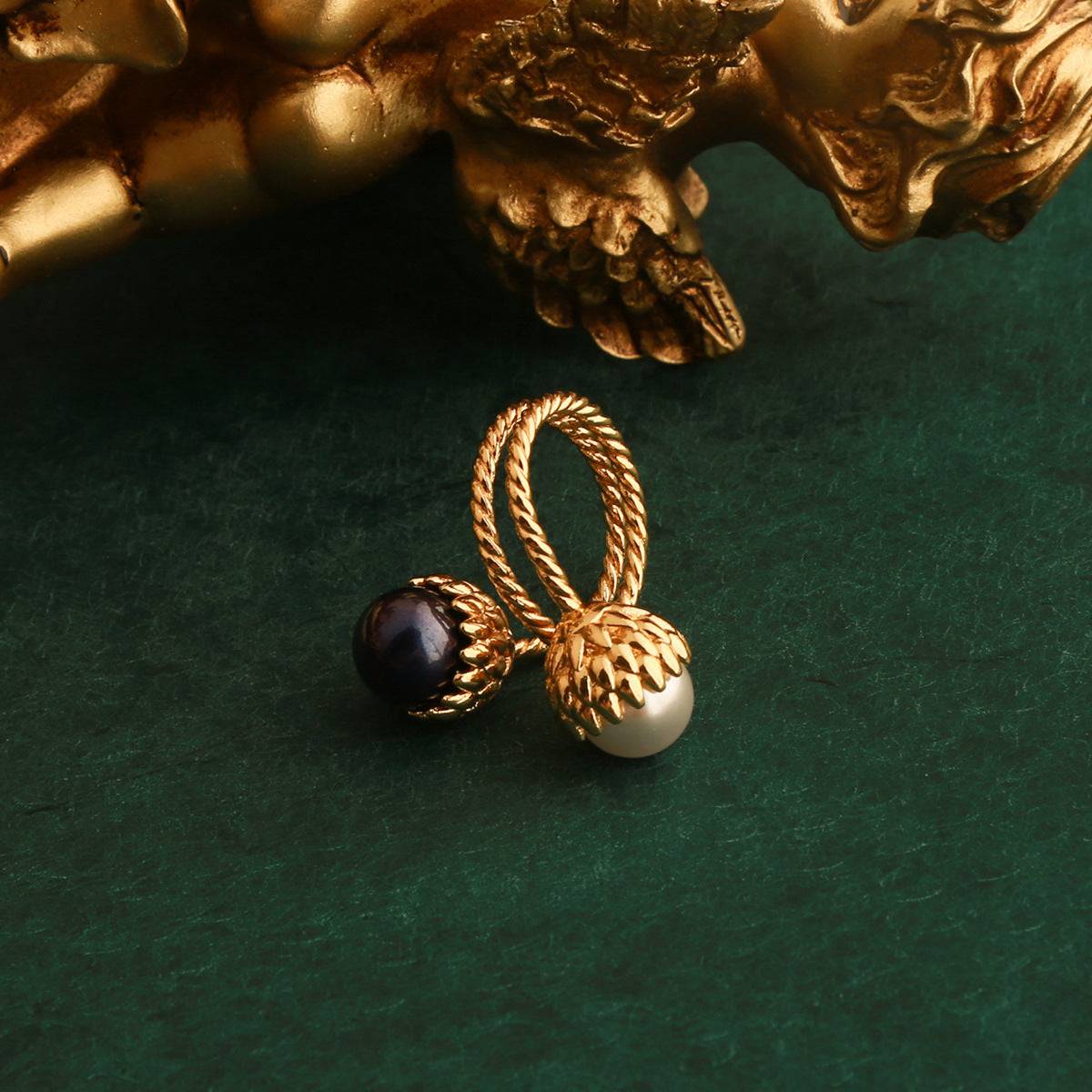 Detailed angle of Ever P. vintage gold pinecone pearl ring highlighting the double-twisted rope shank and open adjustable band.
