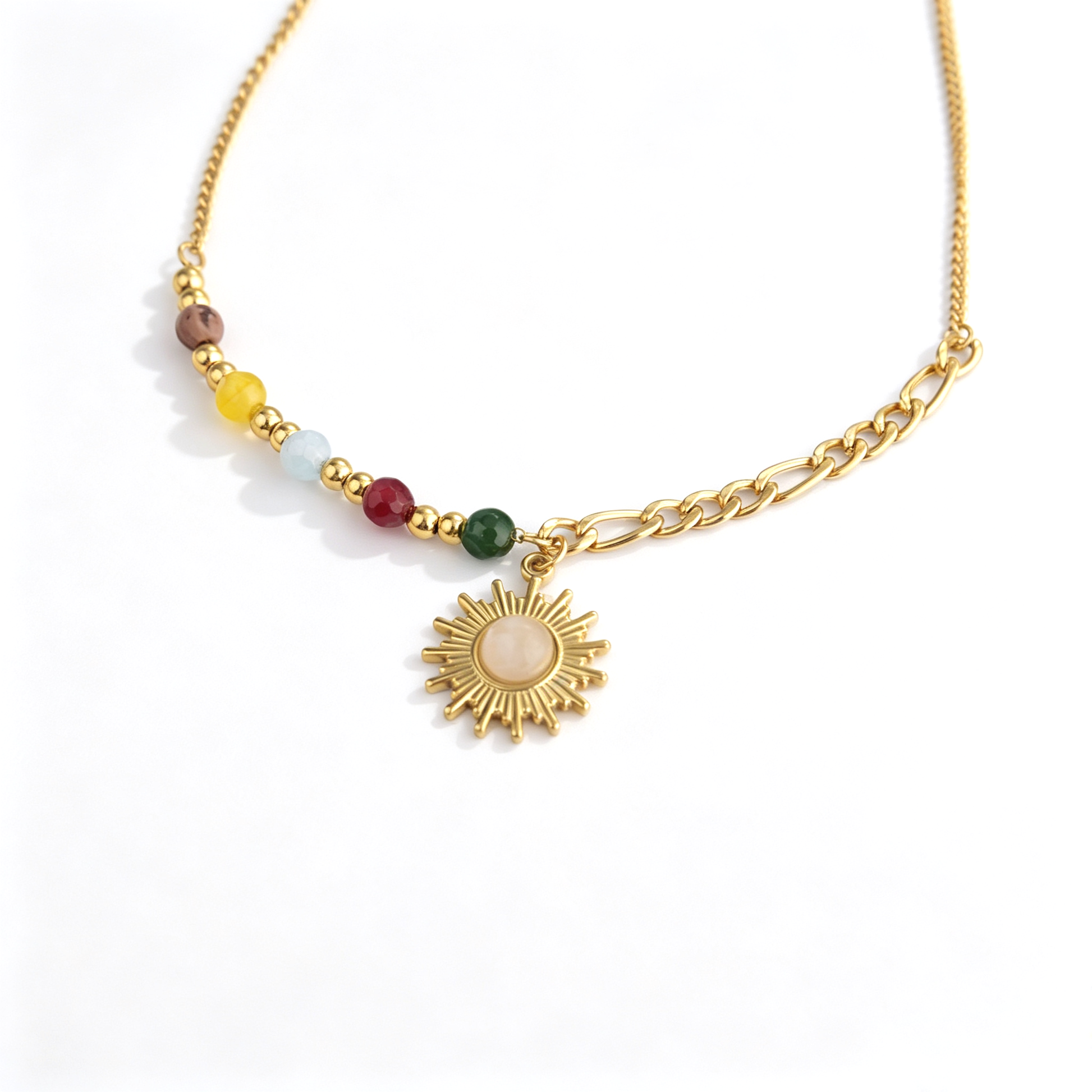 Gold-tone sun pendant necklace with colorful faceted beads and an asymmetrical mixed-link chain.