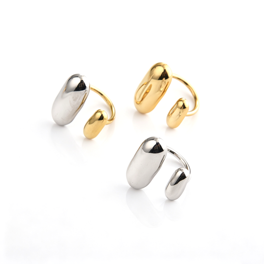 Two-tone sculptural cuff ring shown from an angled front view